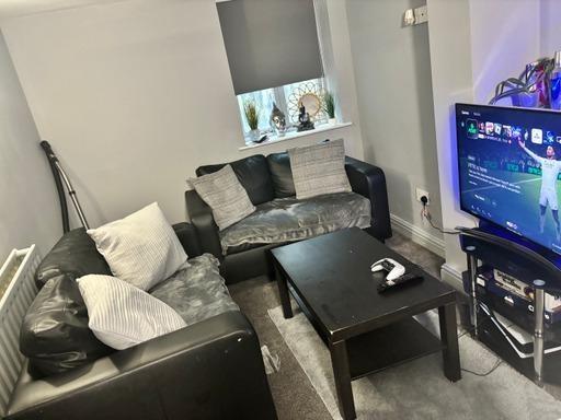 A cozy and well-lit living room featuring moder...