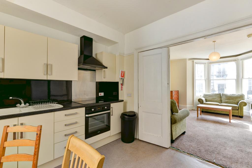 A bright and inviting living room with large wi...