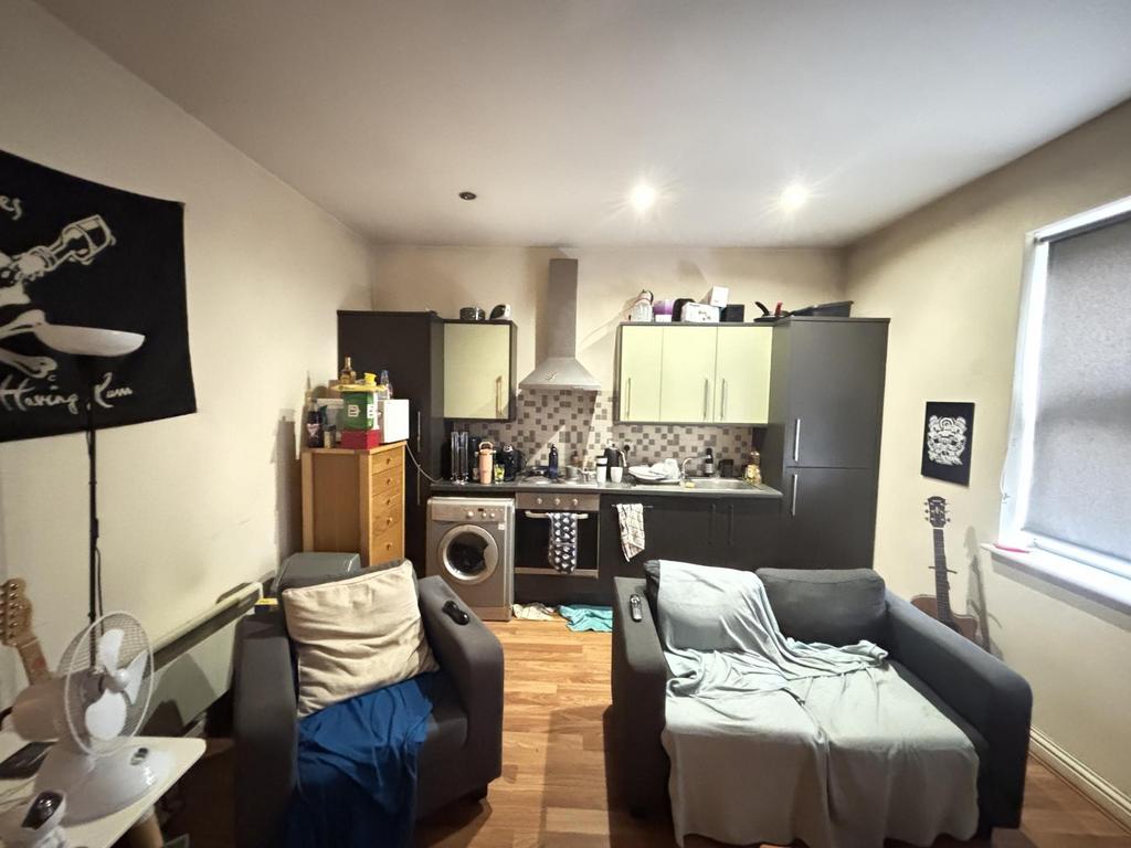 A cozy and well-maintained living room featurin...