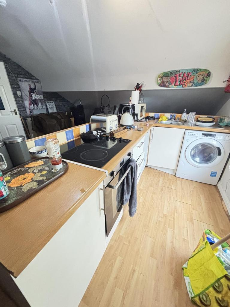 Bright and functional kitchen with modern appli...