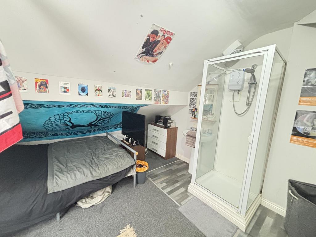 A well-maintained bathroom featuring a shower c...