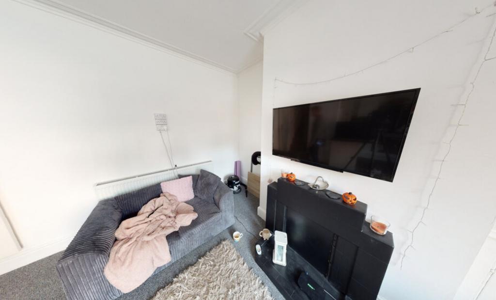 Bright and welcoming living room with large win...
