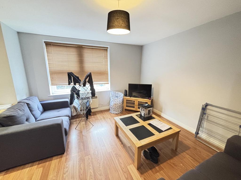 Bright and welcoming living room with a large w...