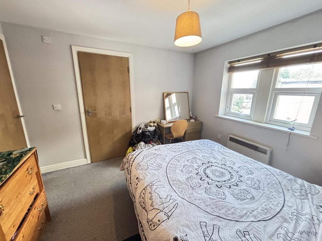 Bright and inviting master bedroom featuring a ...