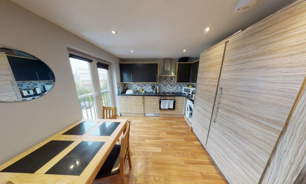 Bright and modern kitchen with ample natural li...