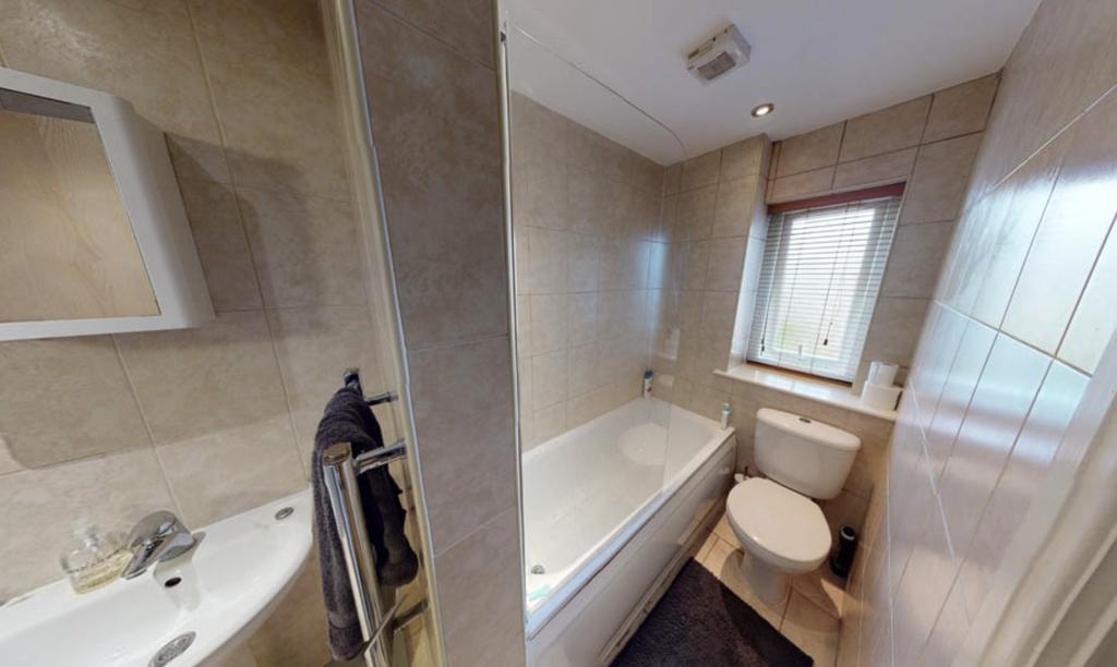 A clean and well-maintained bathroom featuring ...