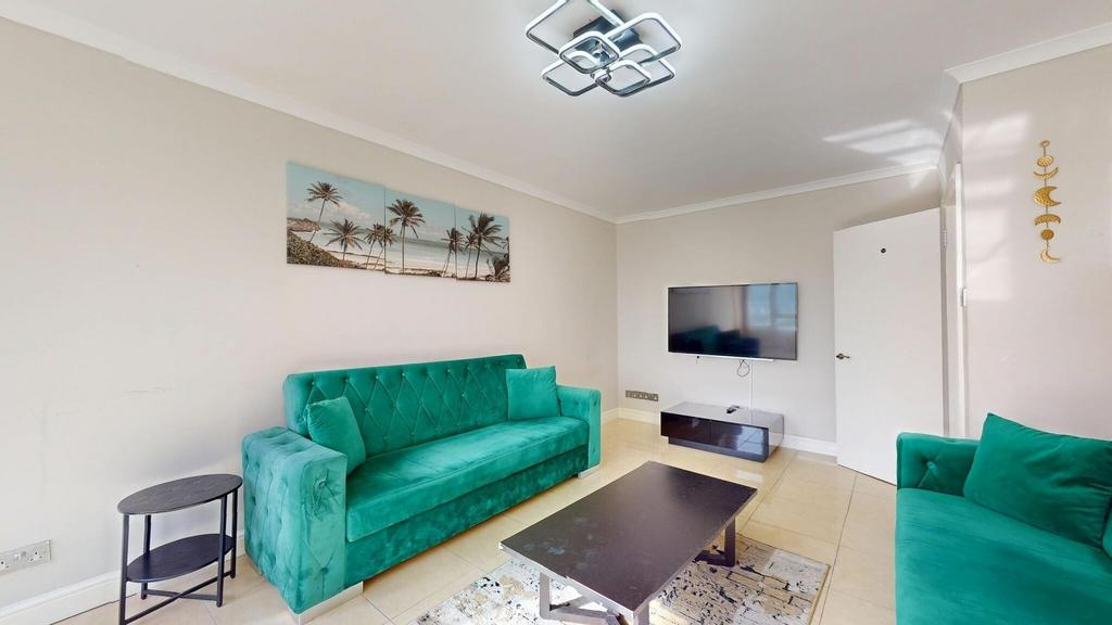Bright and inviting living room featuring vibra...