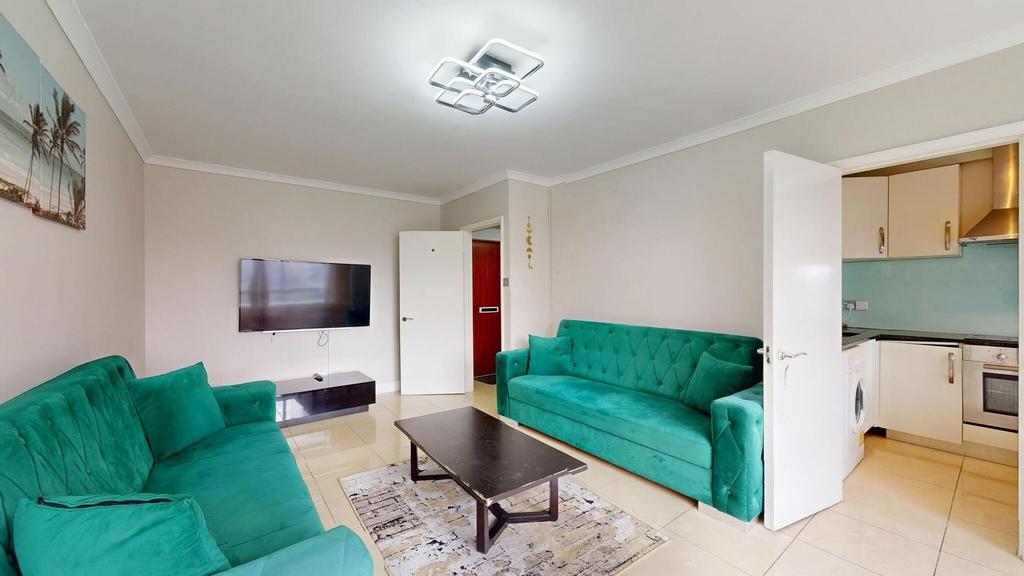 Bright and spacious living room featuring two v...
