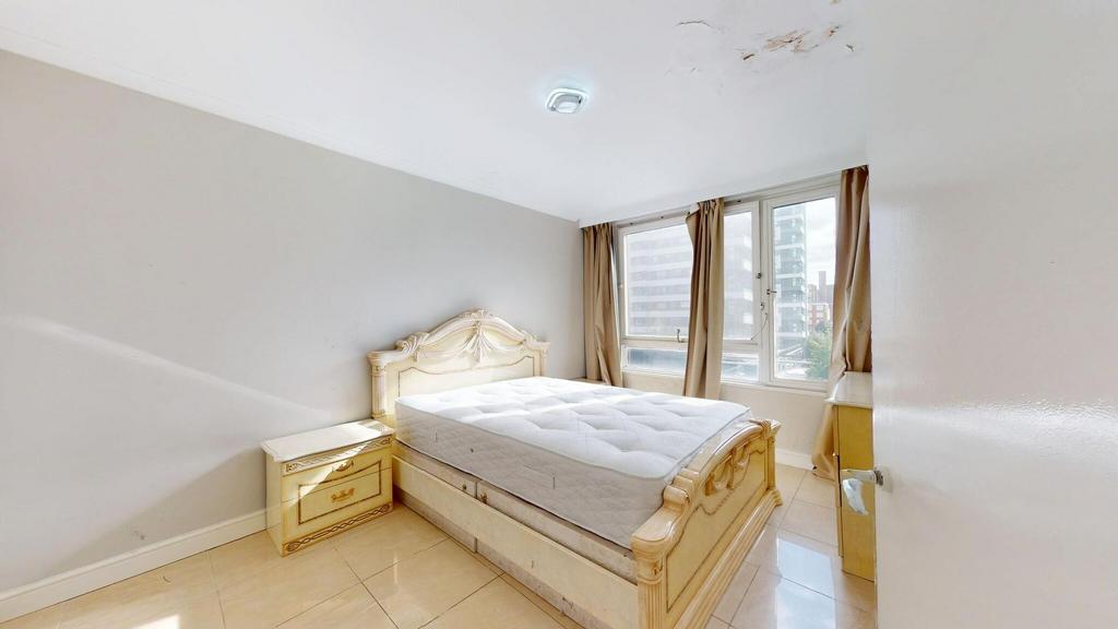 Bright and spacious double bedroom featuring a ...