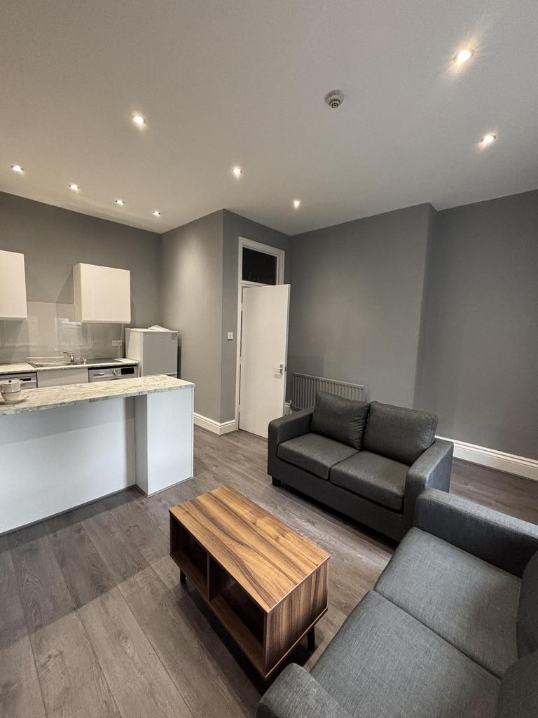 A modern and well-lit living room featuring a c...