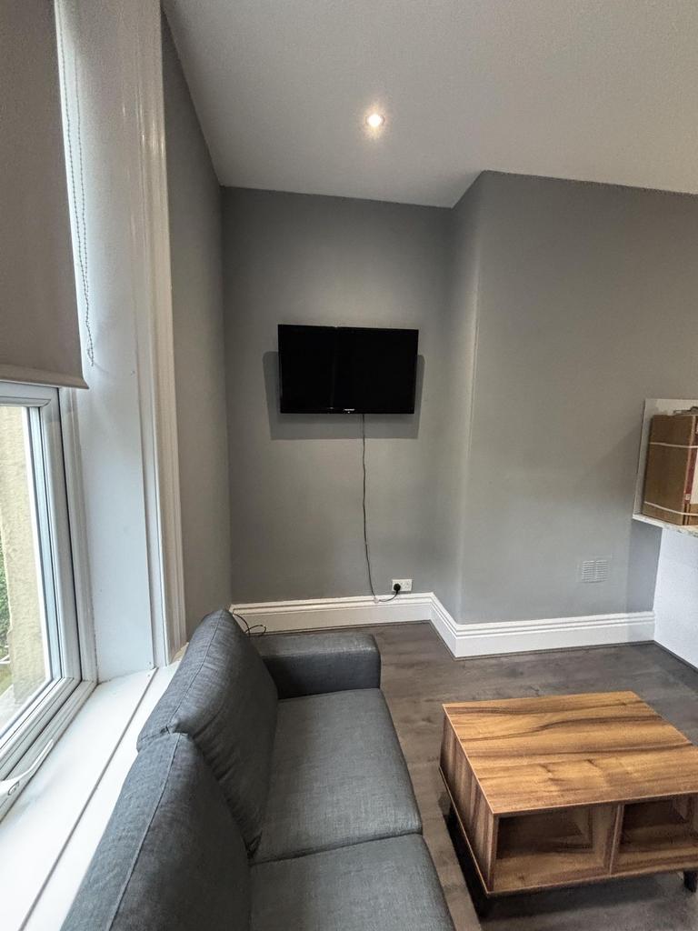 A modern and bright living room featuring a com...