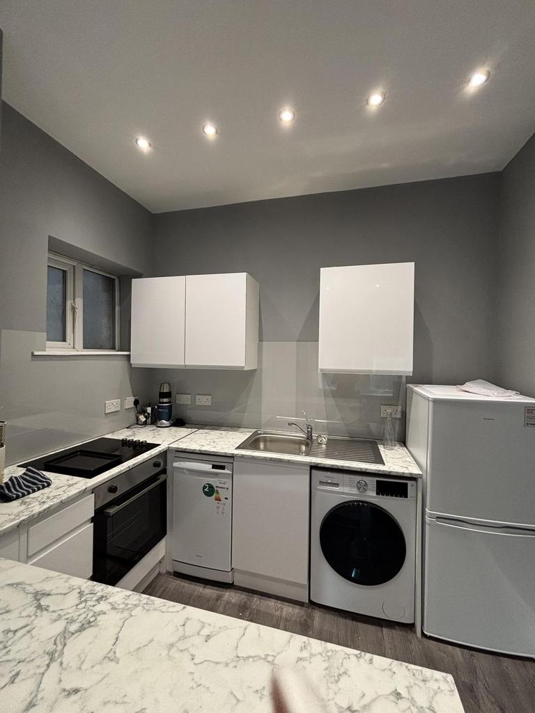 A modern, well-maintained kitchen with ample na...
