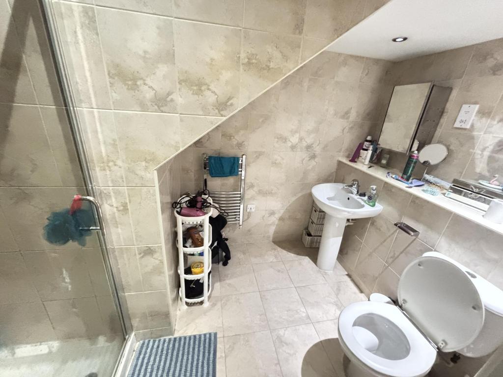 A well-maintained bathroom with a clean sink an...