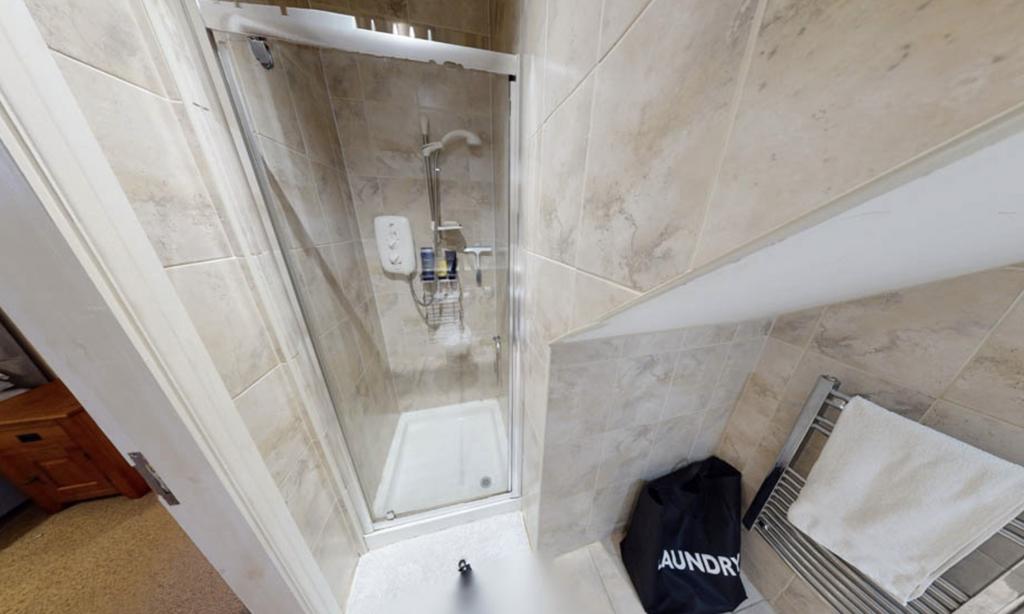 A clean and well-maintained bathroom with a lar...