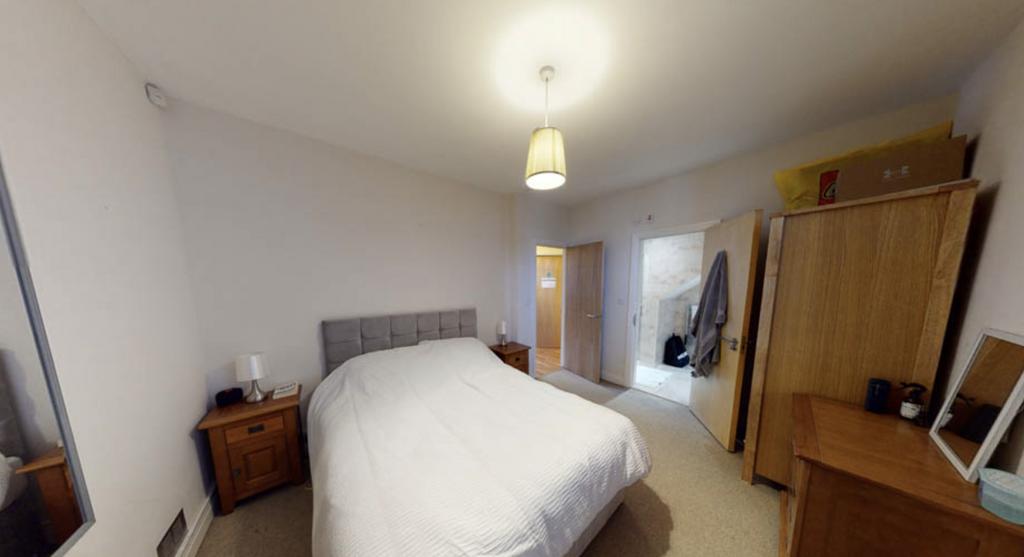 A spacious and well-maintained master bedroom f...
