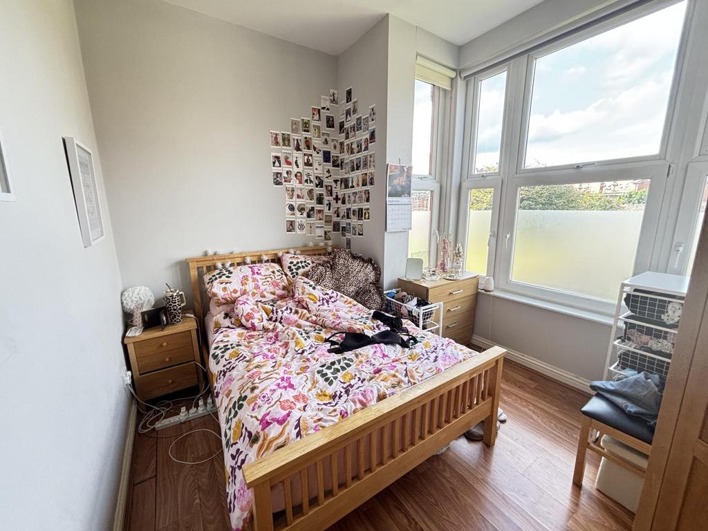 Bright and inviting bedroom with a comfortable ...