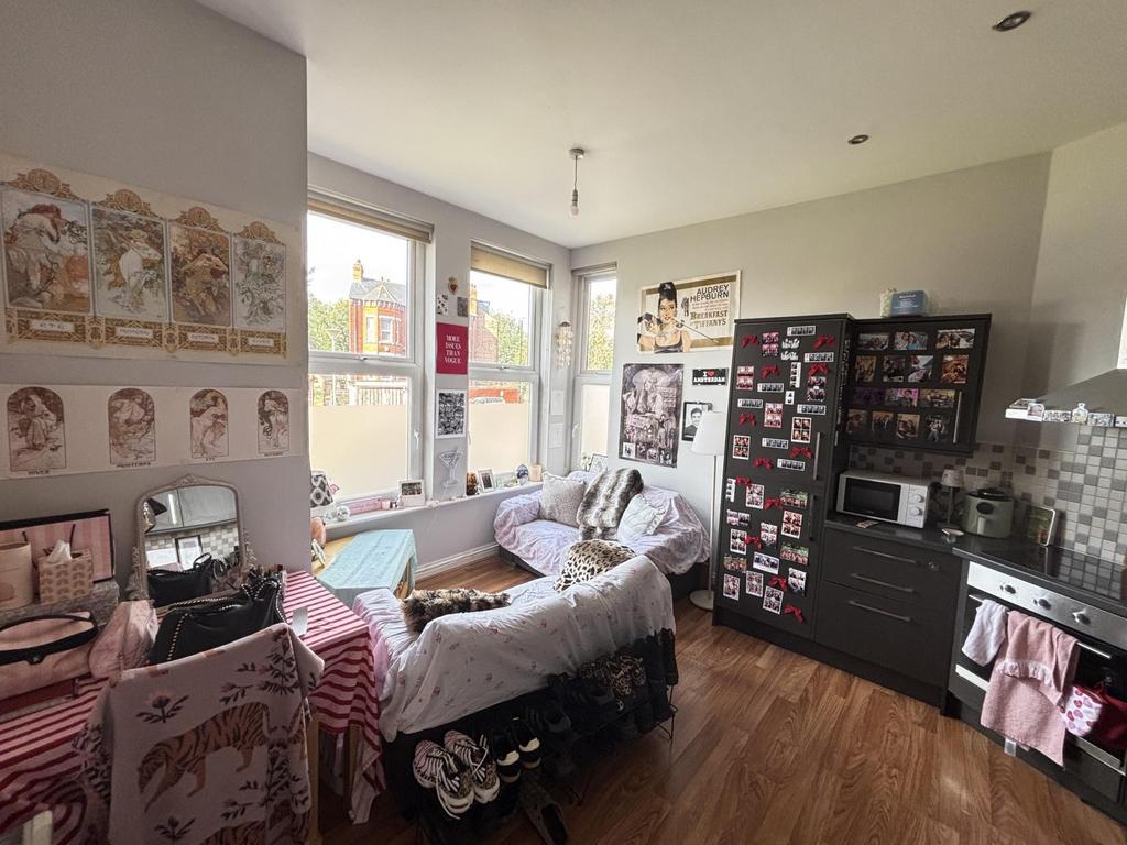 Bright and inviting living room with ample natu...