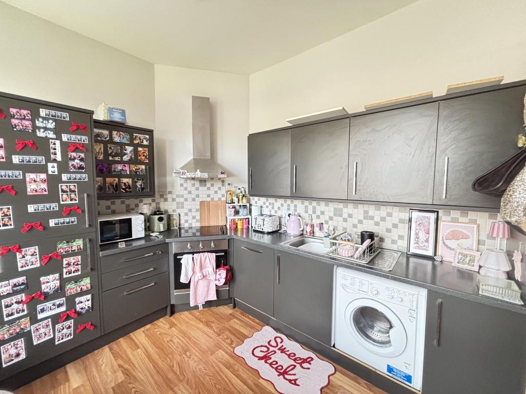 Bright and well-maintained kitchen with modern ...