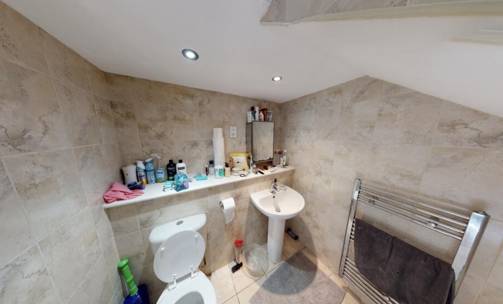 A functional bathroom with a bathtub, basic fix...
