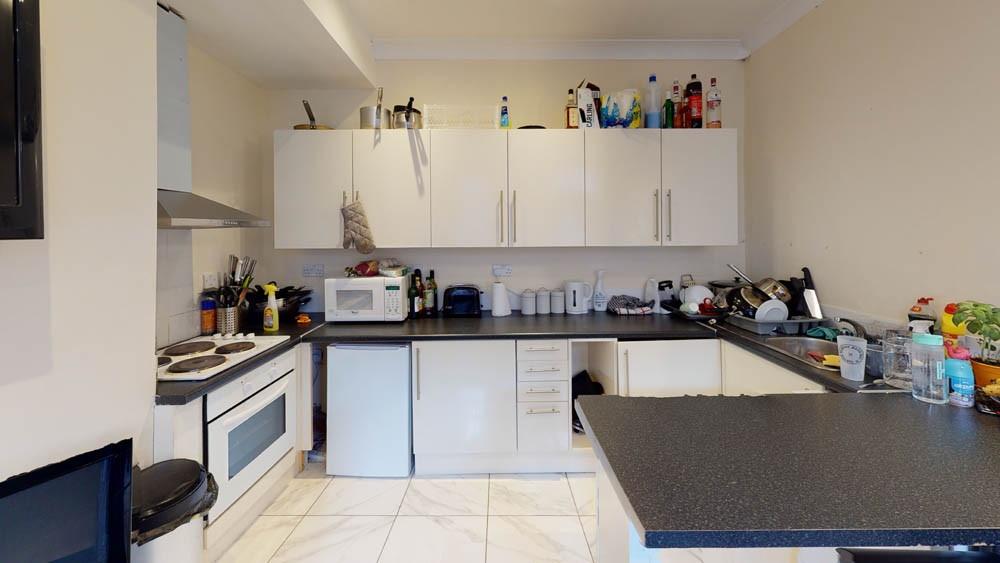 Bright and well-equipped kitchen with plenty of...