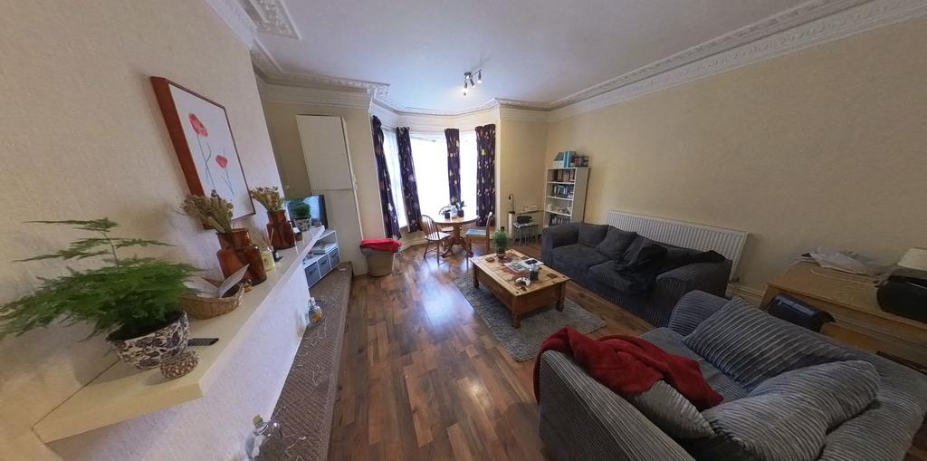 A spacious and inviting living room filled with...