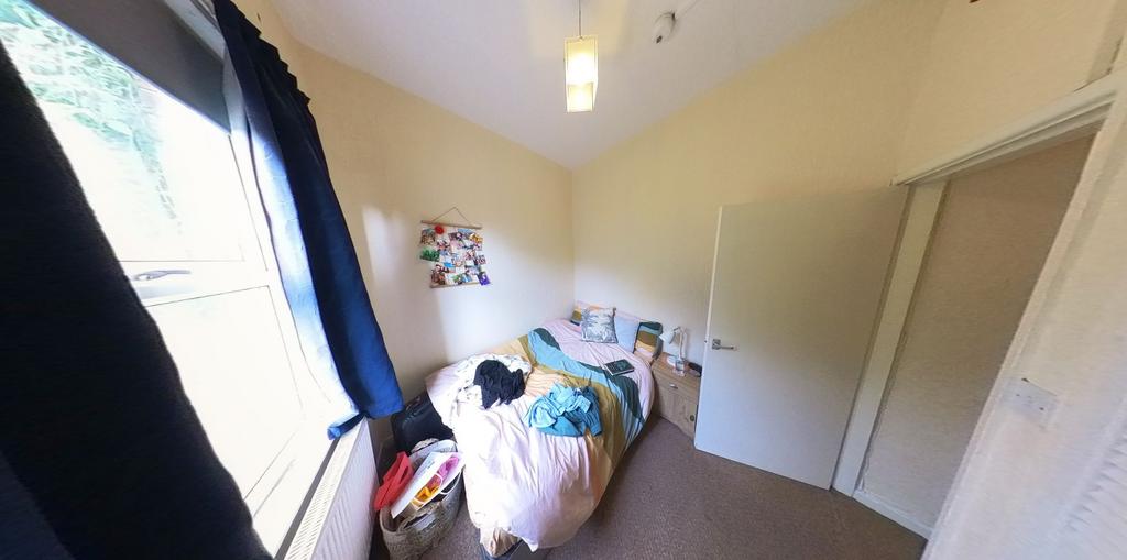 A bright and cozy bedroom with a comfortable do...