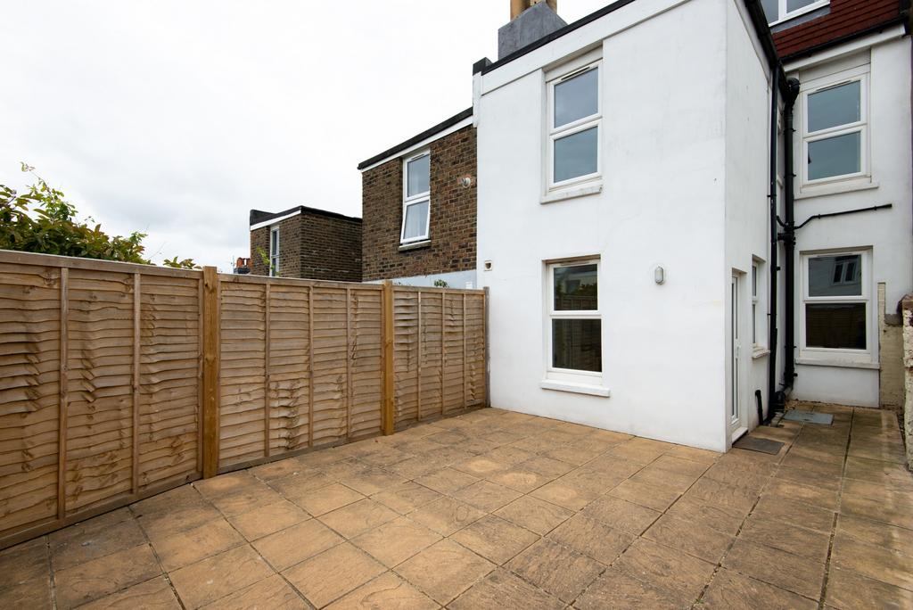 A tidy and well-maintained exterior view of the...