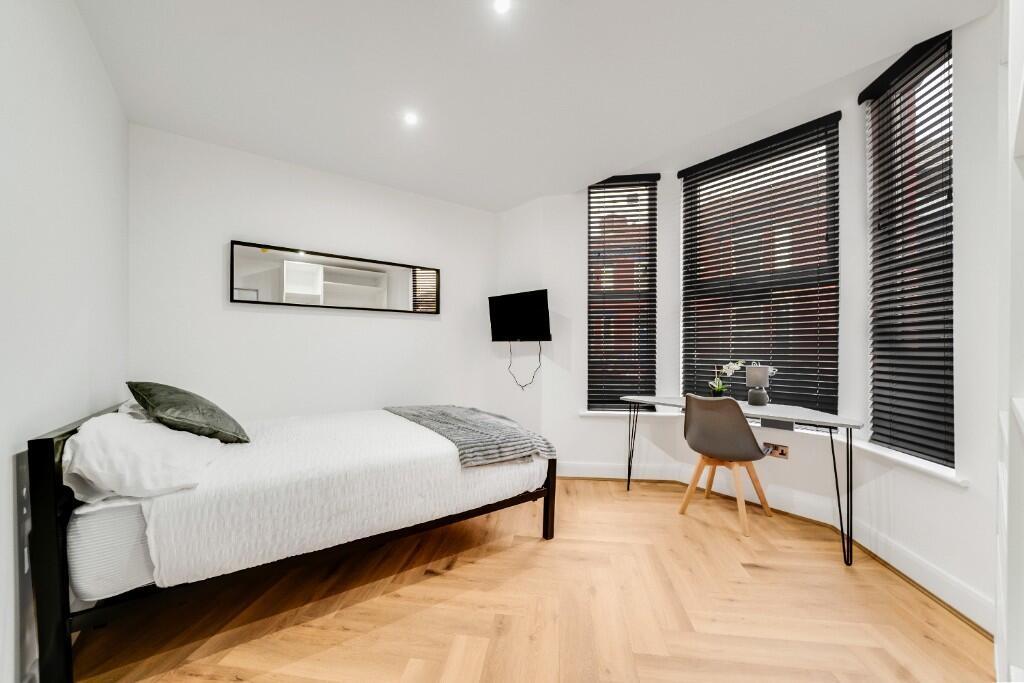 Beautifully furnished master bedroom featuring ...