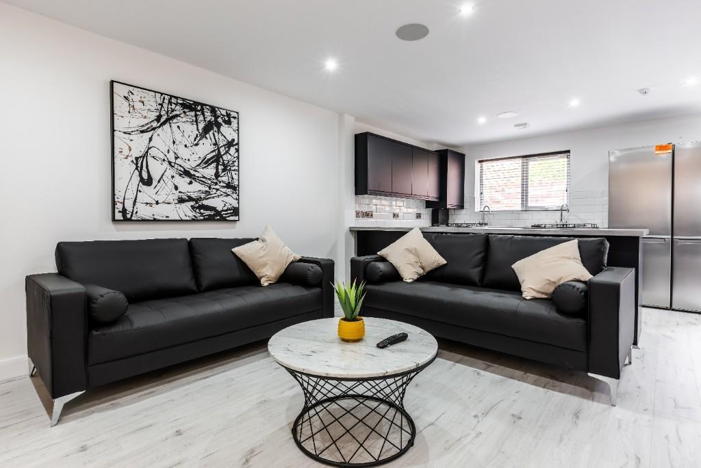 A spacious and well-lit modern living room feat...