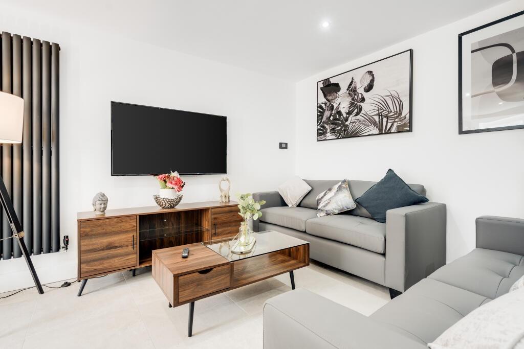 Modern and welcoming living room featuring a co...