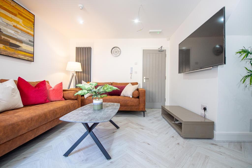 A bright and inviting living room featuring mod...