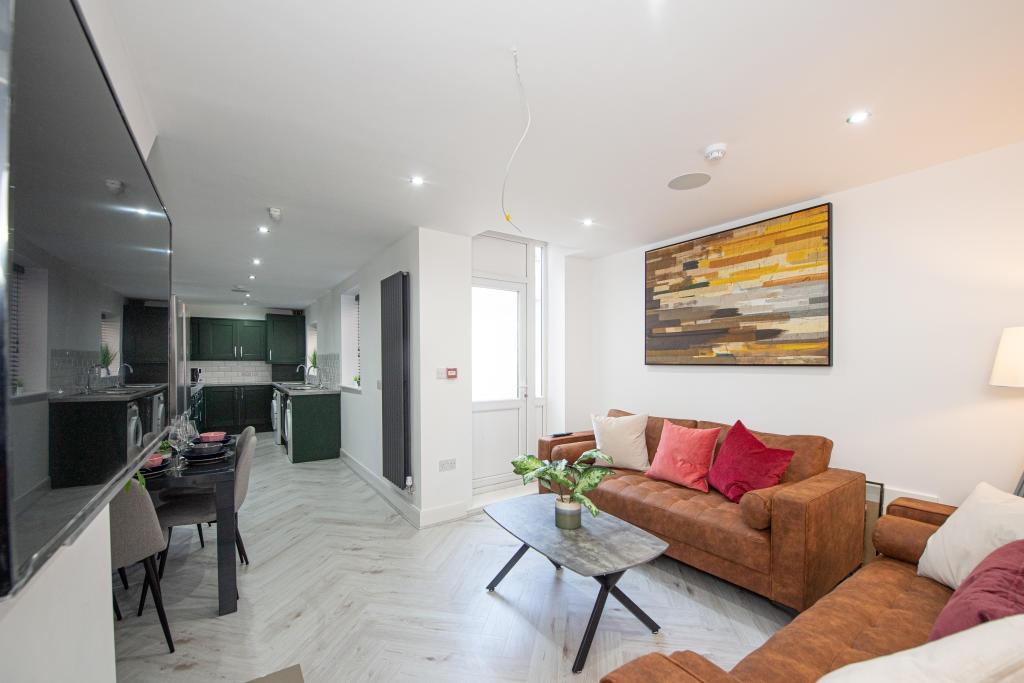 A bright and welcoming living room with modern ...