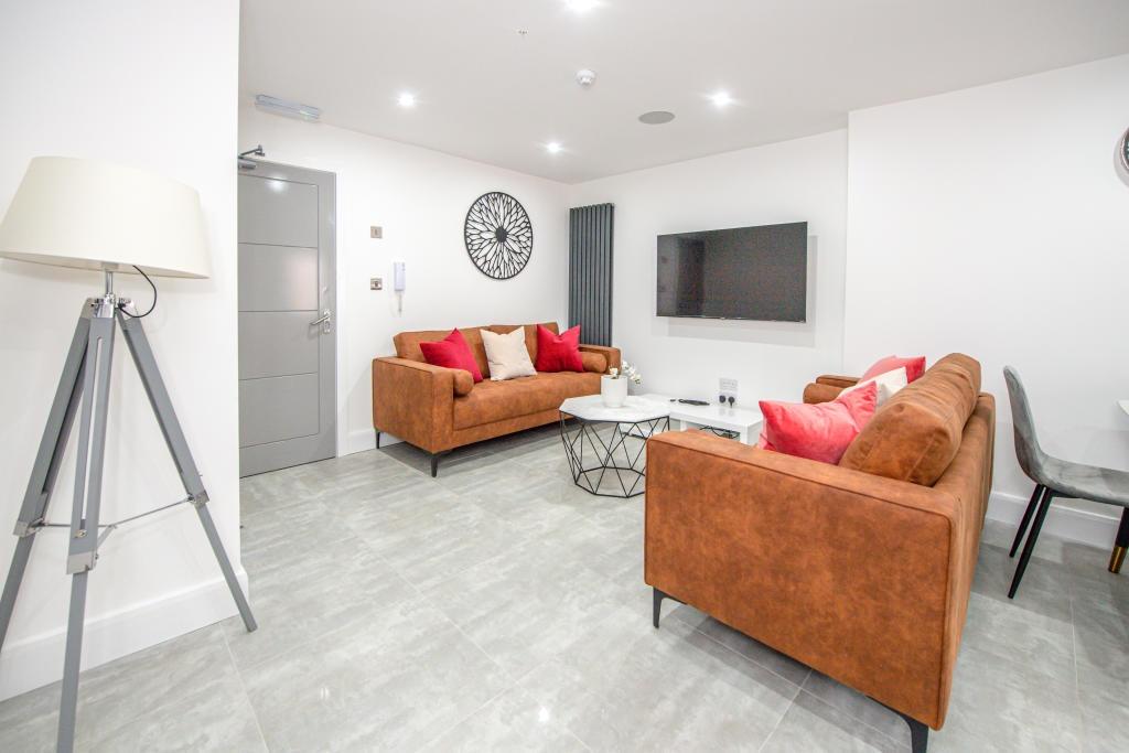 Bright and welcoming living room featuring mode...