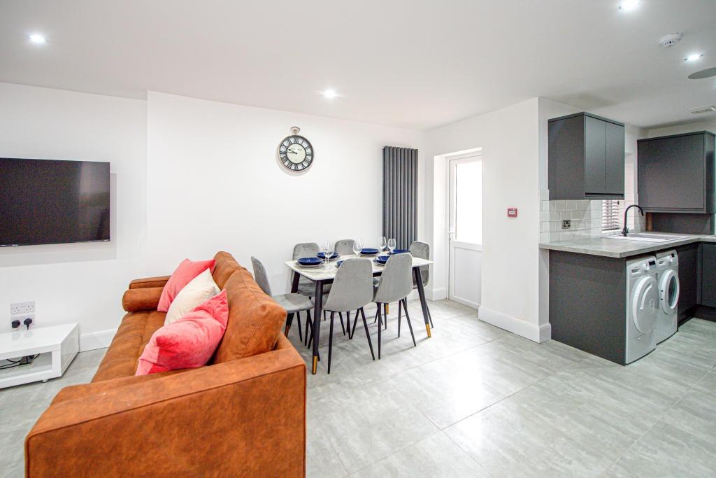 Modern and spacious living area with contempora...