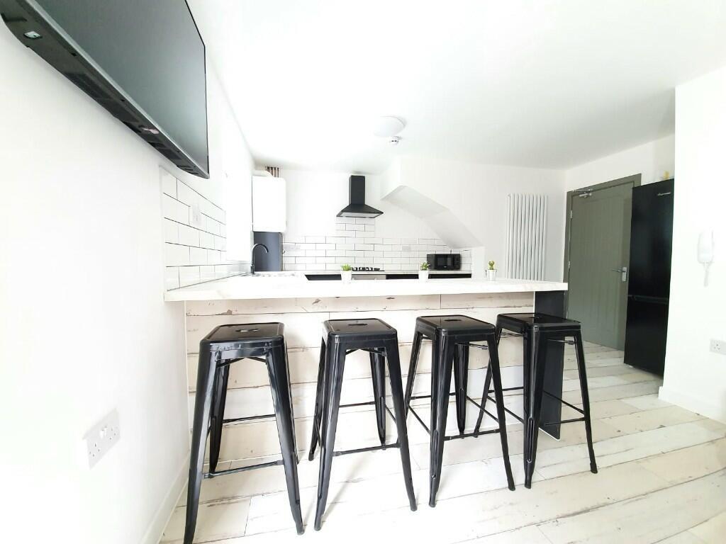Bright and modern kitchen with a clean, minimal...