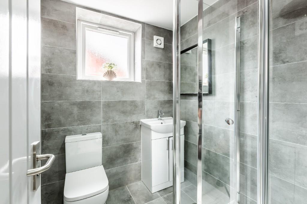 Modern and well-maintained bathroom with a spac...