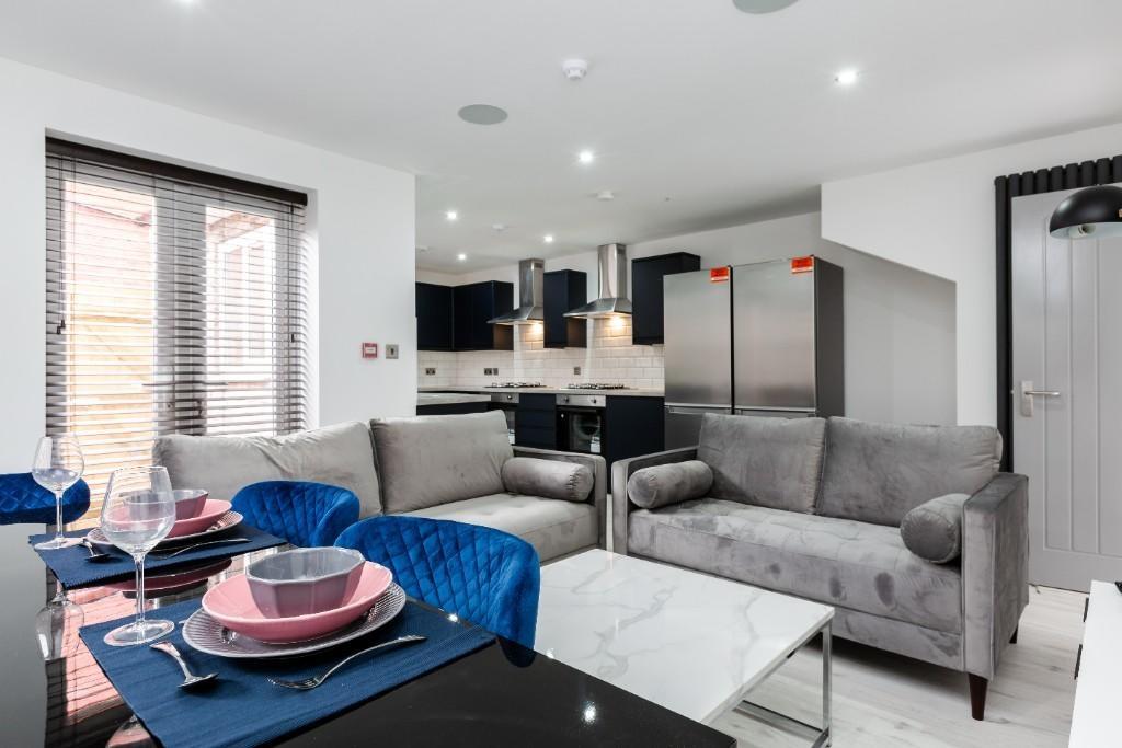 Modern and spacious living room with stylish gr...