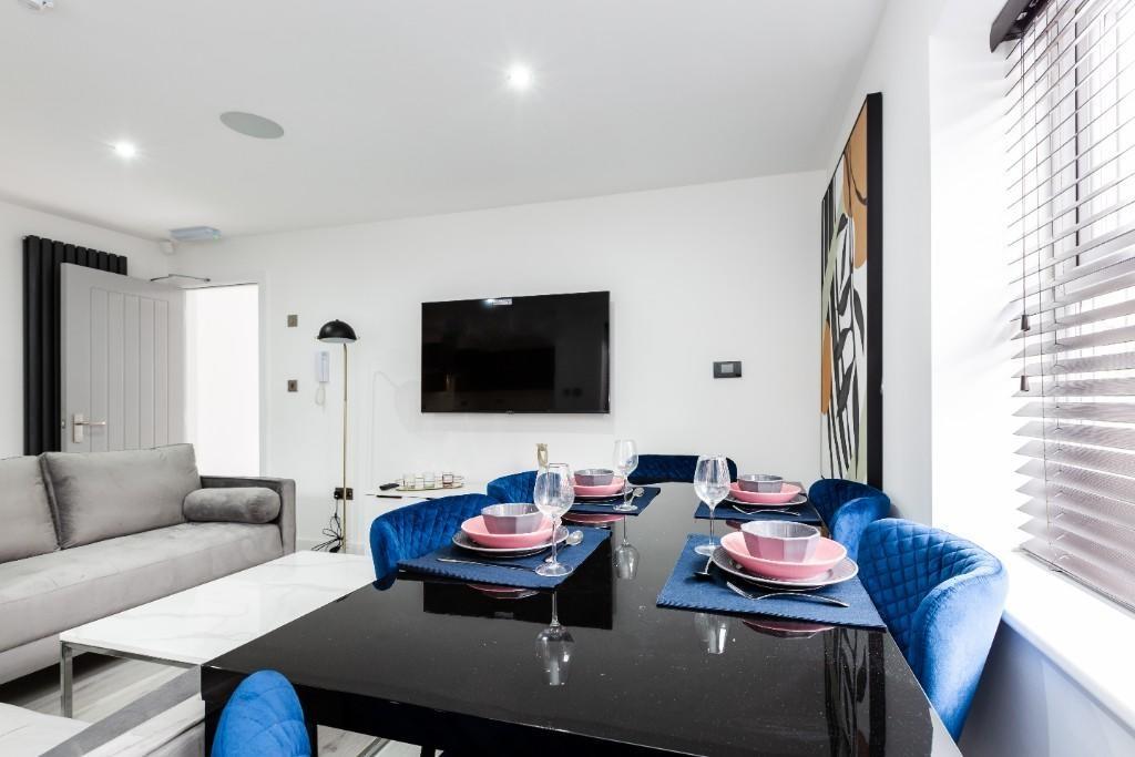 A modern and well-lit living room featuring a s...