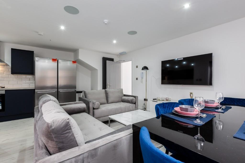 Modern and spacious living room featuring a lar...