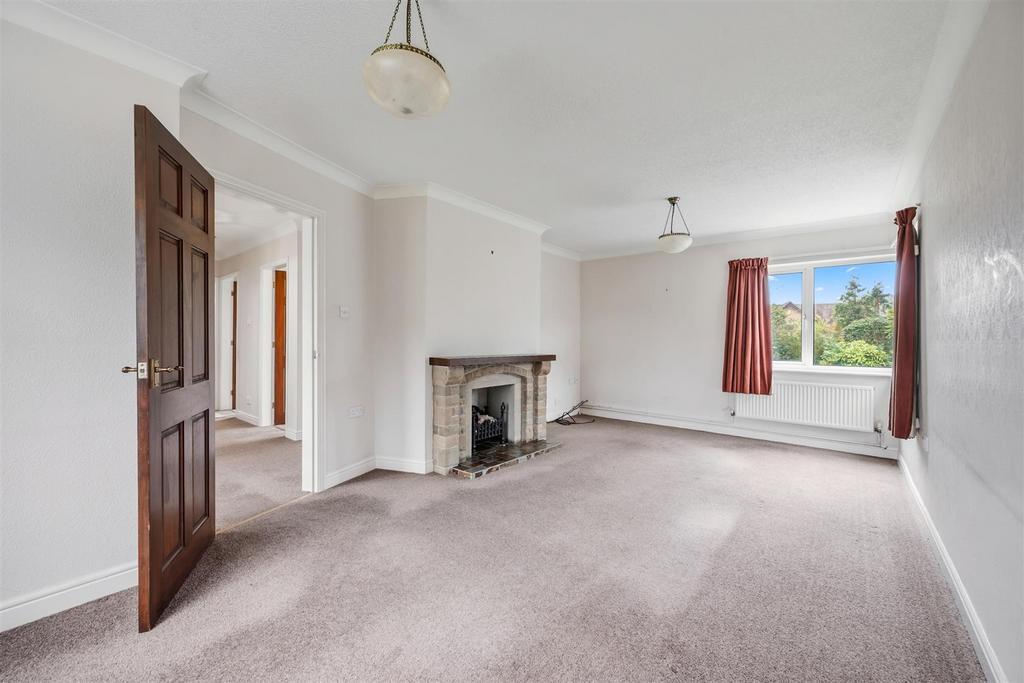 Sitting Room to rear window and fireplace.jpg