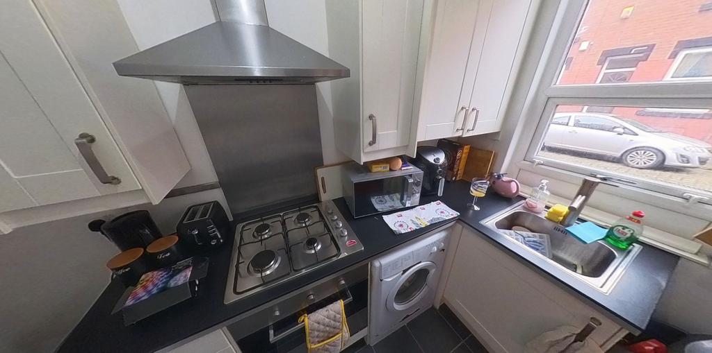 A well-equipped kitchen with modern appliances ...