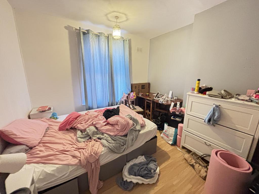 A cozy bedroom with natural light streaming thr...