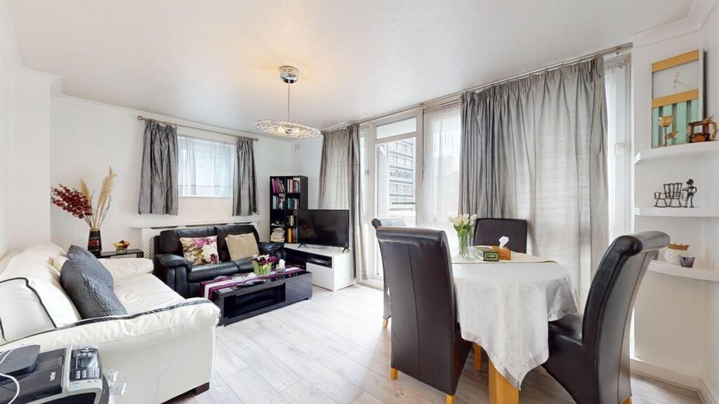 Bright and welcoming living room with large win...