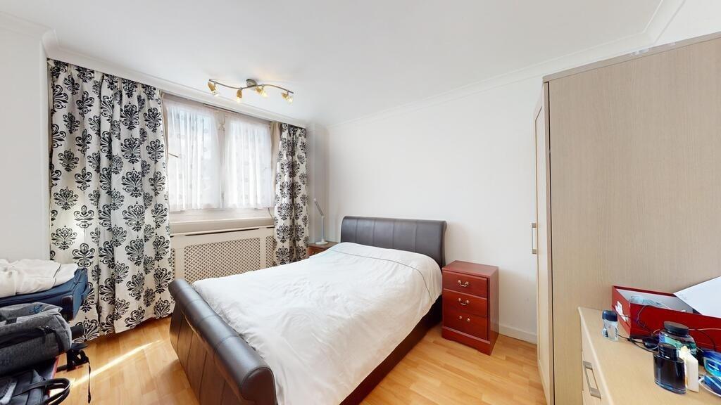A bright and welcoming double bedroom featuring...