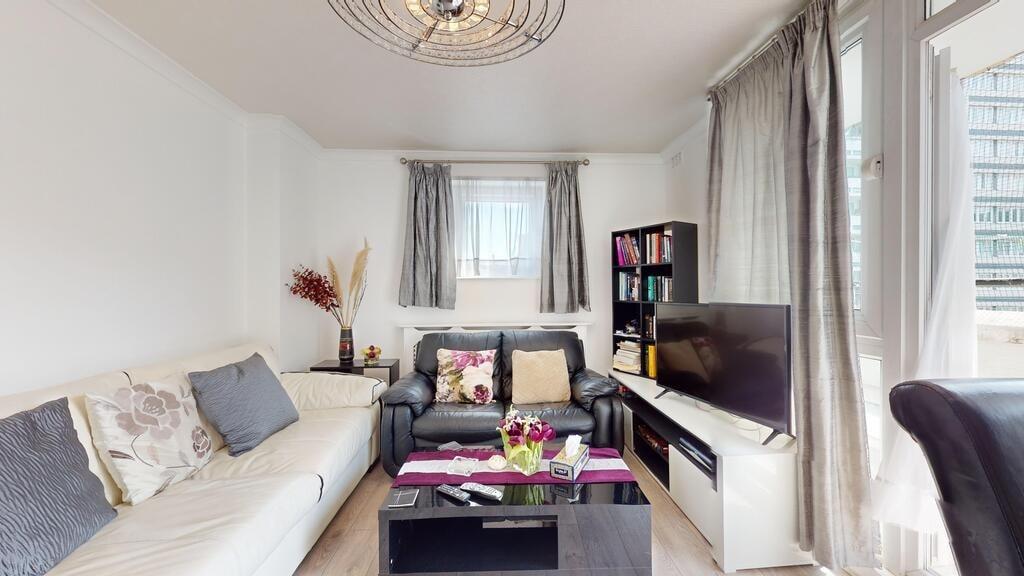 Bright and welcoming living room featuring comf...
