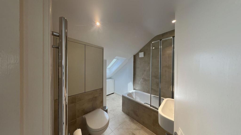 Modern bathroom featuring a large bathtub with ...
