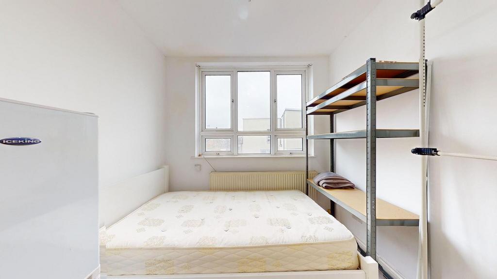 Bright and simple double bedroom featuring a la...