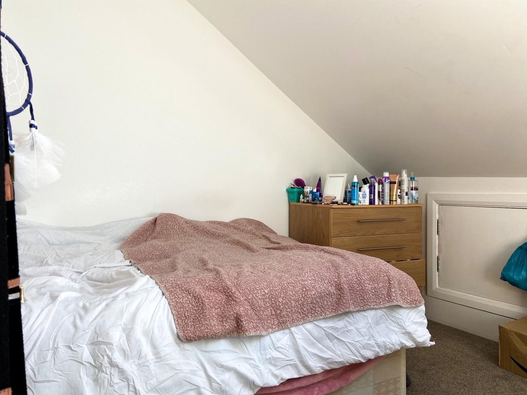 Cozy attic double bedroom with sloped ceiling, ...