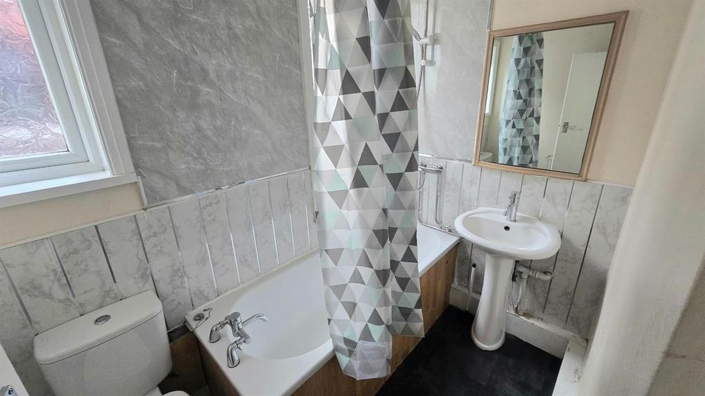 A clean and well-maintained bathroom featuring ...