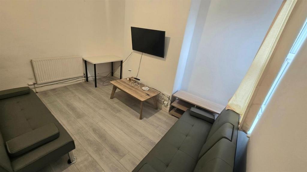 A well-maintained communal lounge featuring com...